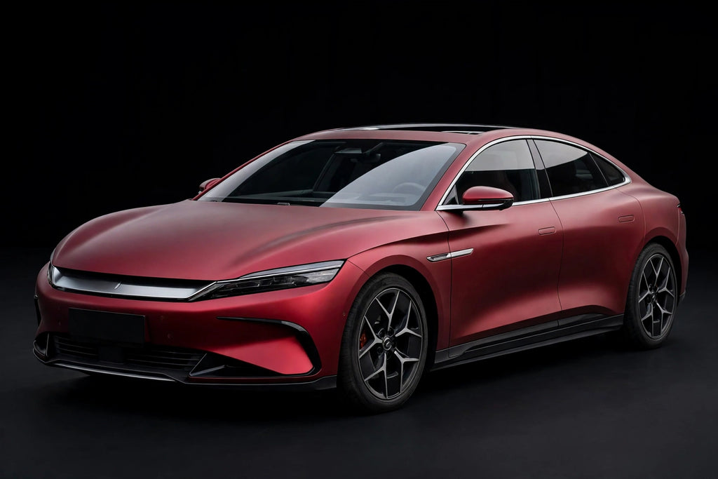 Ultra Matte Chrome Romani Red PET vinyl wrap film on a car, front three-quarter studio view