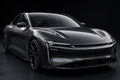 6DUltra Carbon Fiber Black Silver PET vinyl wrap film on a car, front three-quarter studio view