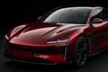 Super Gloss Premium Galaxy Black Red / PET vinyl wrap film on a car, front three-quarter studio view