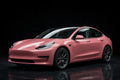 Super Gloss Ume Pink PET vinyl wrap film on a car, front three-quarter studio view