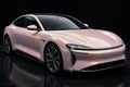 Super Gloss Pink Gold PET vinyl wrap film on a car, front three-quarter studio view
