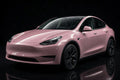 Super Gloss Rosewood Pink PET vinyl wrap film on a car, front three-quarter studio view