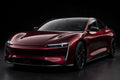Super Gloss Pearl Black Red PET vinyl wrap film on a car, front three-quarter studio view