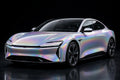 Super Gloss Iridescent Psychedelic Sliver PET vinyl wrap film on a car, front three-quarter studio view
