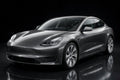 Super Gloss Tungsten Gray Metallic PET vinyl wrap film on a car, front three-quarter studio view