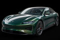 Super Gloss Metallic Dark Jade Green PET vinyl wrap film on a car, front three-quarter studio view