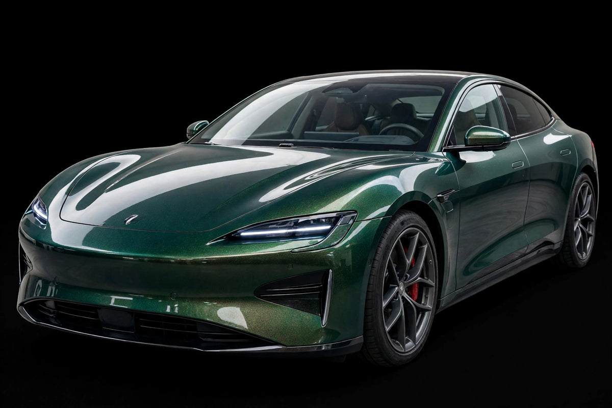Super Gloss Metallic Dark Jade Green PET vinyl wrap film on a car, front three-quarter studio view