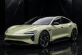 Super Gloss Khaki Green PET vinyl wrap film on a car, front three-quarter studio view