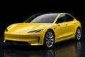 Super Gloss Corn Yellow PET vinyl wrap film on a car, front three-quarter studio view