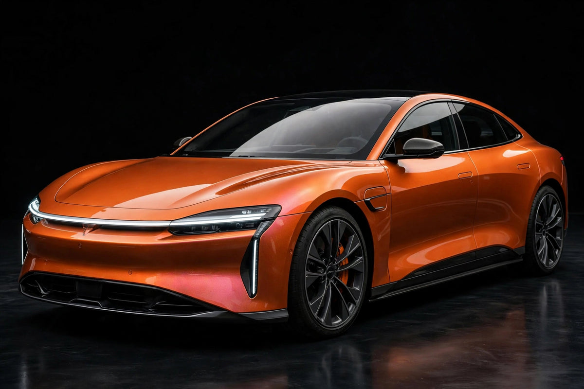 Phantom Flare Racing Orange PET vinyl wrap film on a car, front three-quarter studio view