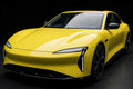 Super Gloss Lemon Yellow PET vinyl wrap film on a car, front three-quarter studio view