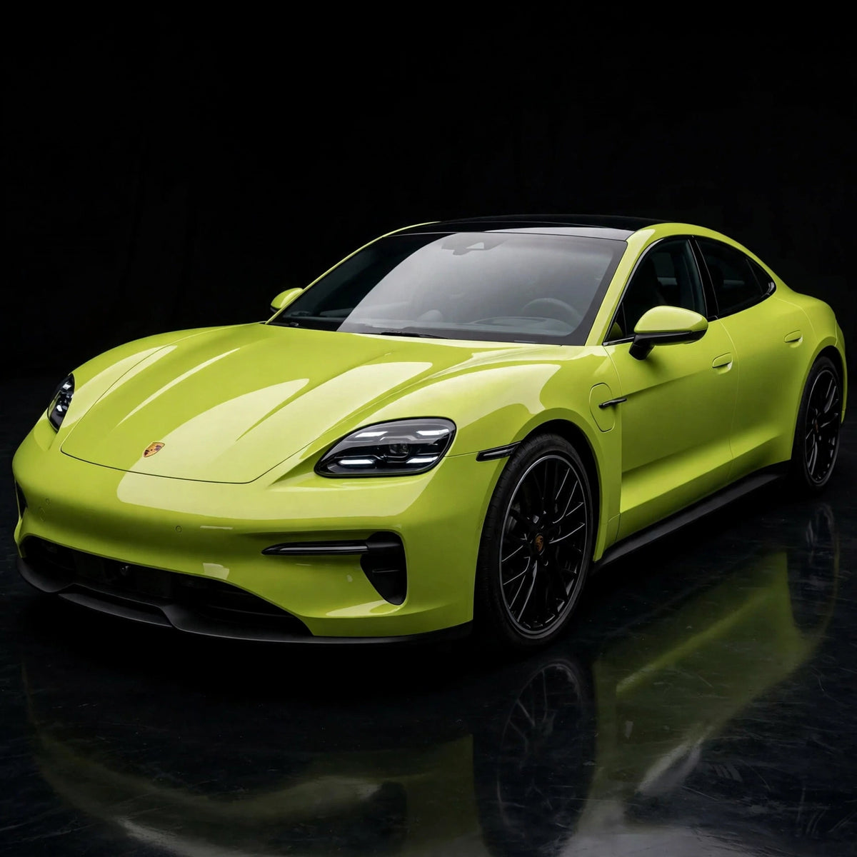 Super Gloss Coral Yellow PET vinyl wrap film on a car, front three-quarter studio view