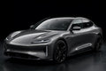 Super Gloss Liquid Combat Gray PET vinyl wrap film on a car, front three-quarter studio view