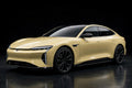 Super Gloss Dune Yellow PET vinyl wrap film on a car, front three-quarter studio view