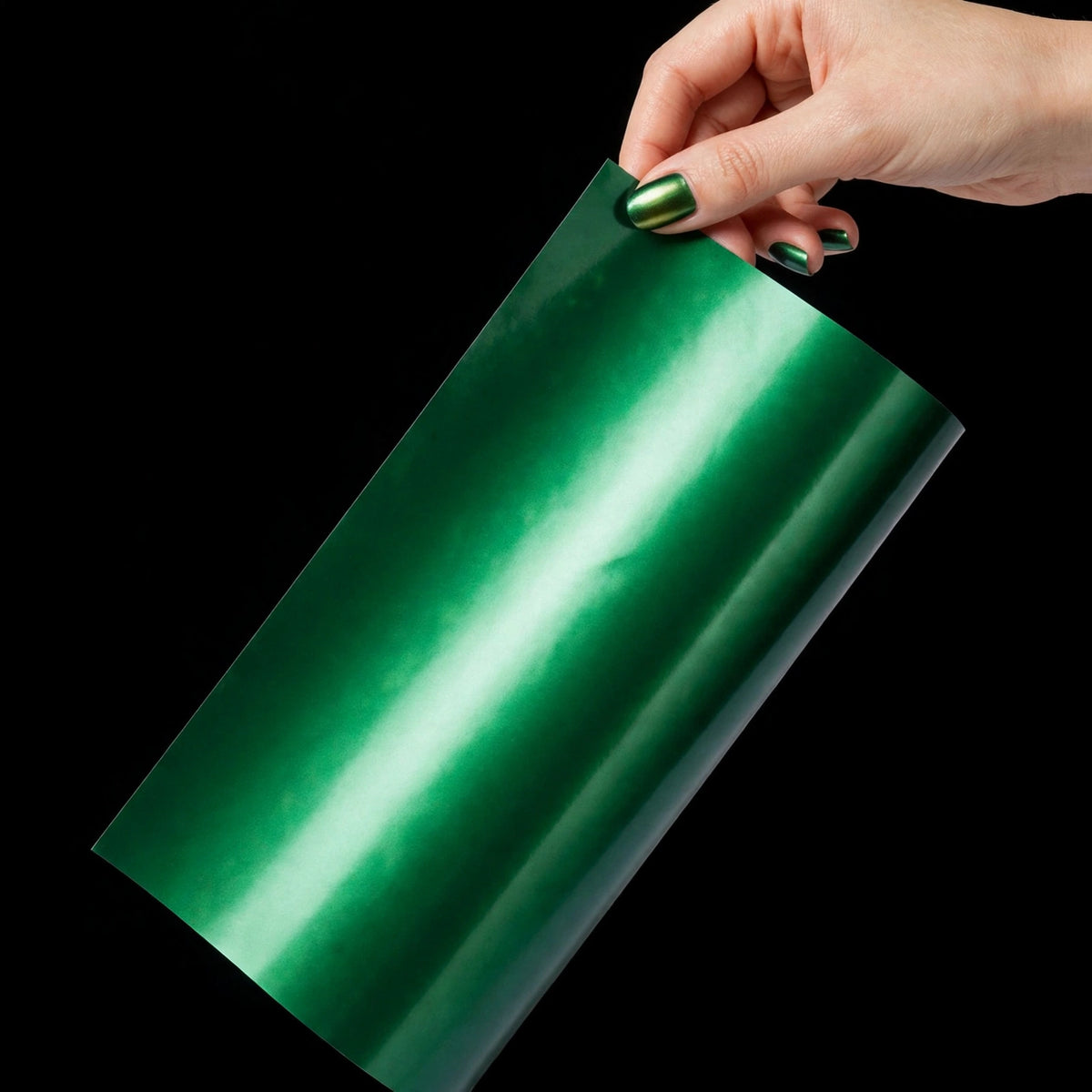 Chrome Venom Green vinyl wrap film sheet held in hand