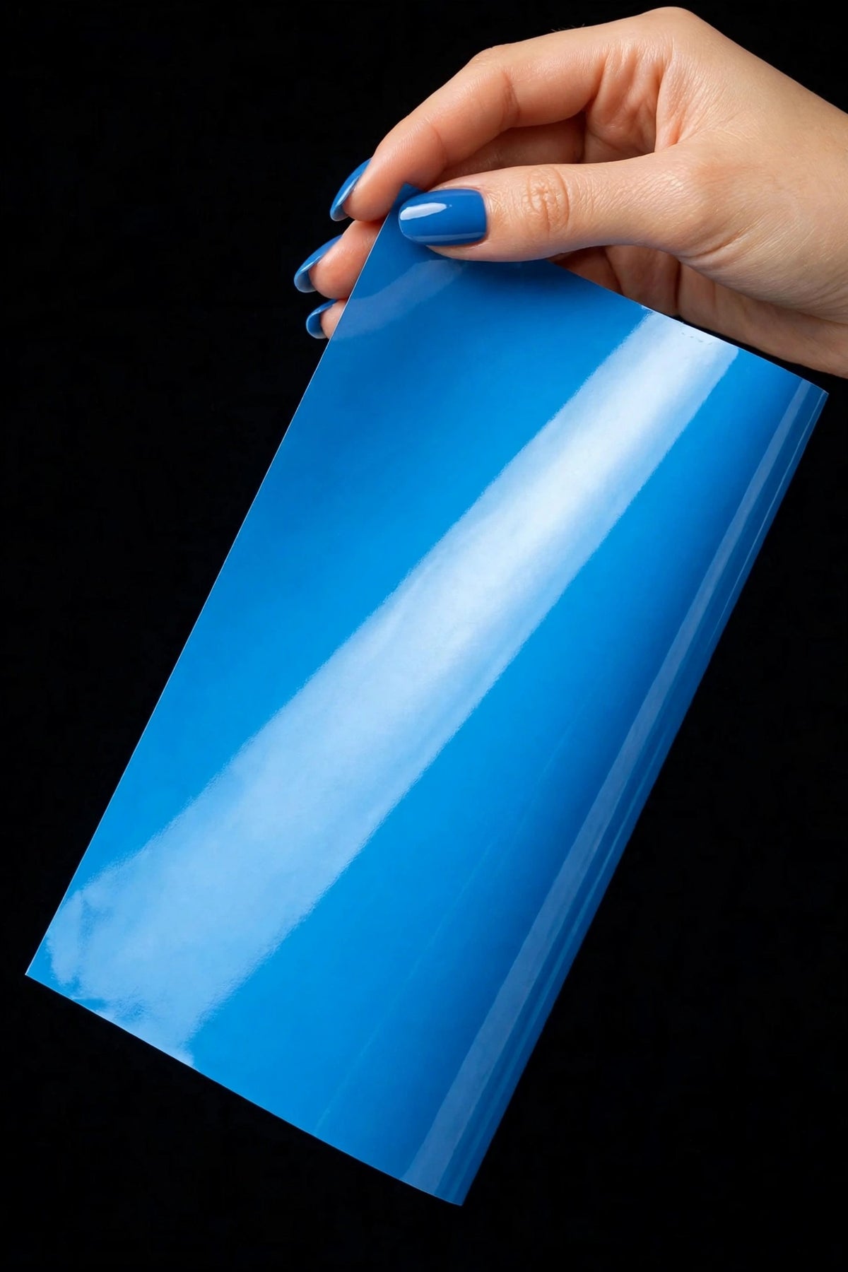 Super Gloss Ice Cream Blue vinyl wrap film sheet held in hand