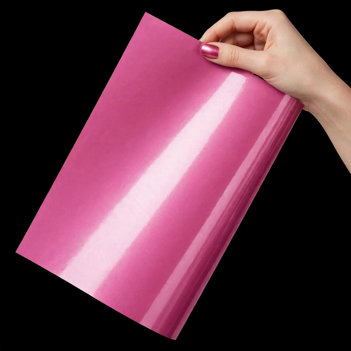 Super Gloss Morganite Red Metallic vinyl wrap film sheet held in hand