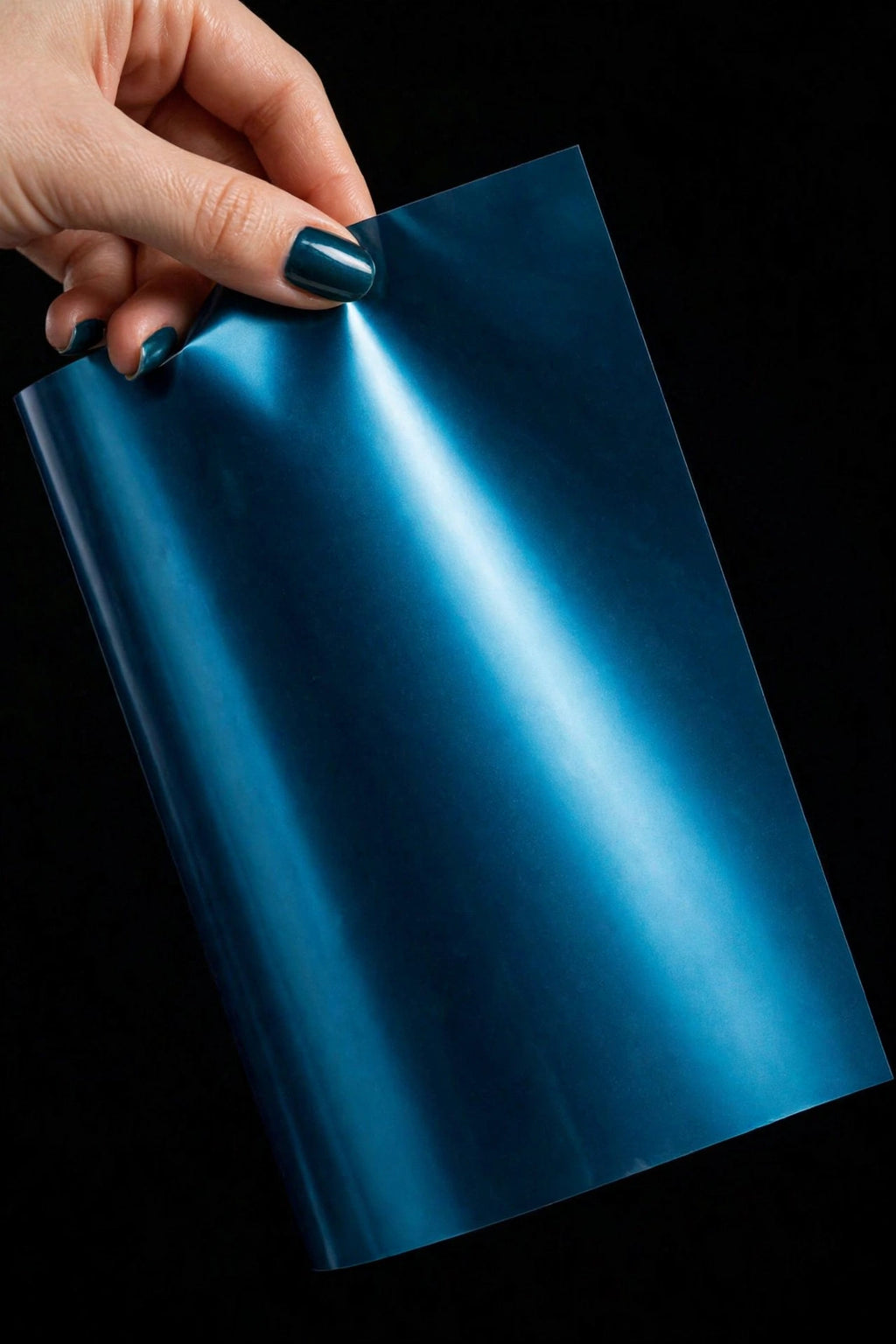 Super Gloss Midnight Cyan Metallic vinyl wrap film sheet held in hand