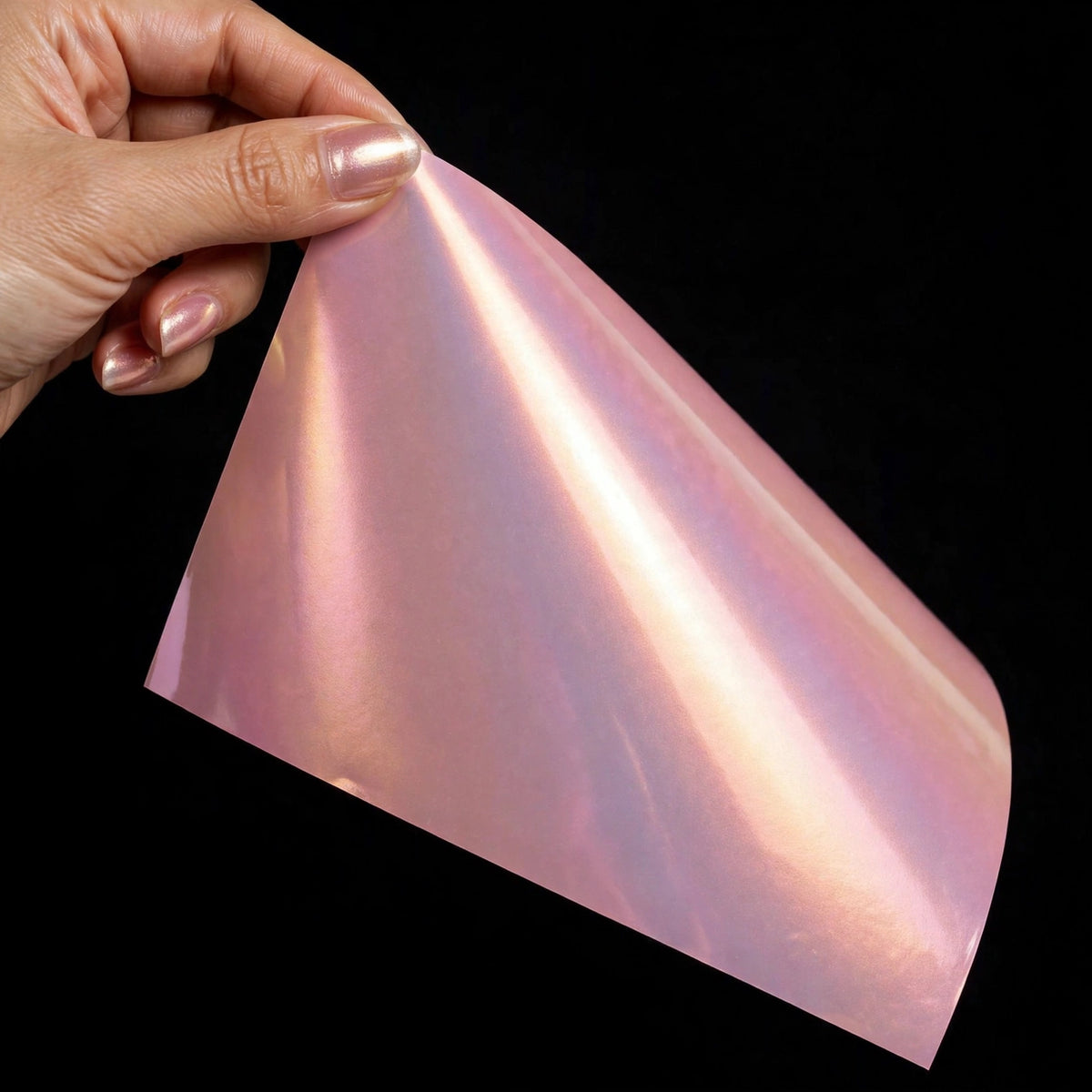 Super Gloss Pink Gold vinyl wrap film sheet held in hand