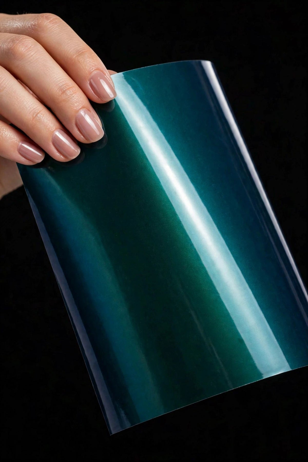 Super Gloss Aurora Green R vinyl wrap film sheet held in hand