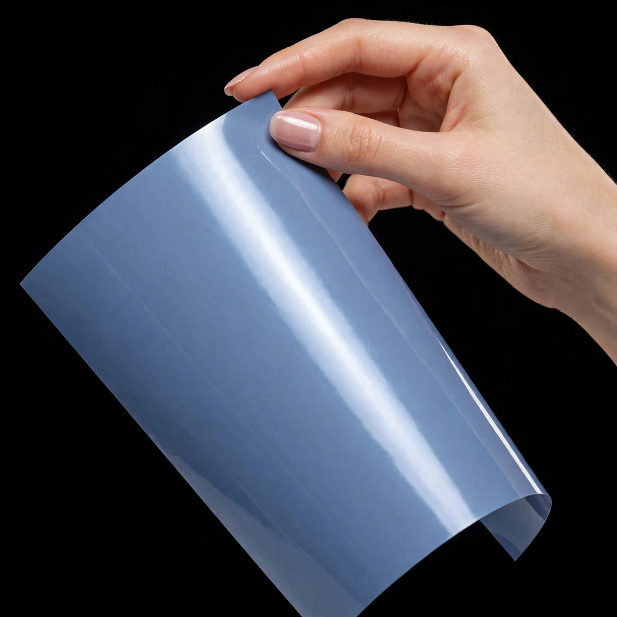 Super Gloss Meteor Blue vinyl wrap film sheet held in hand