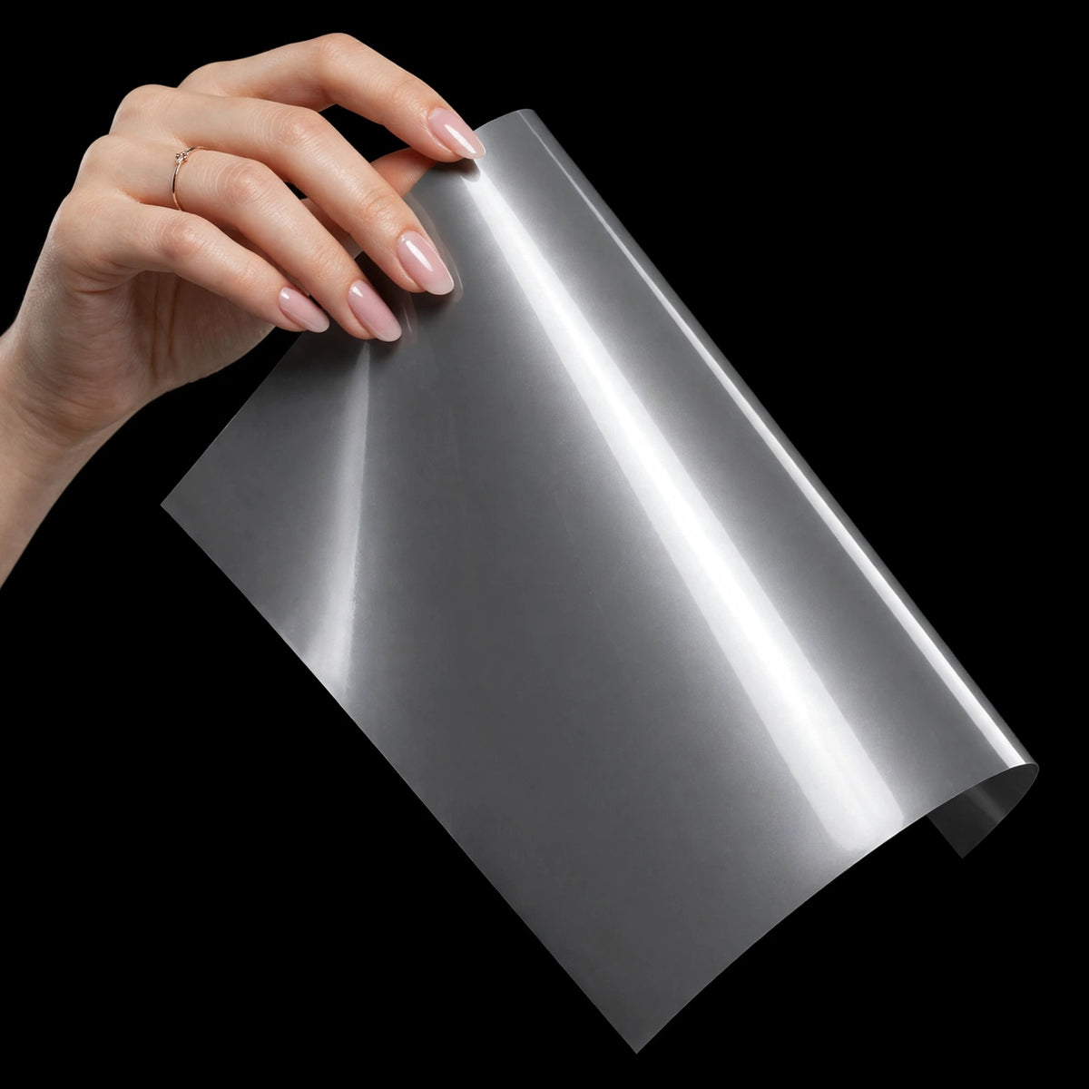 Super Gloss Mercury Gray vinyl wrap film sheet held in hand