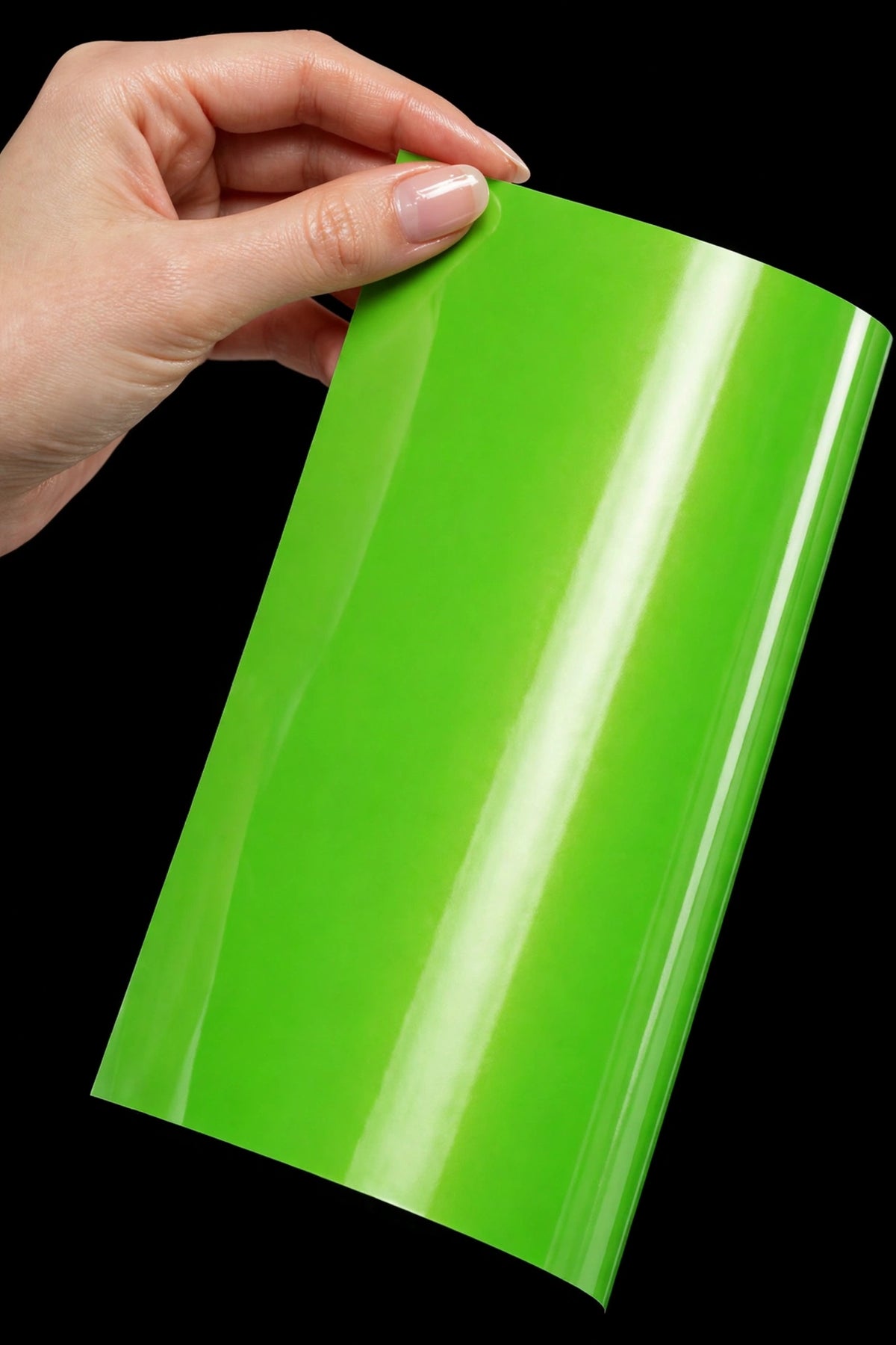 Super Gloss Coral Fruit Green vinyl wrap film sheet held in hand