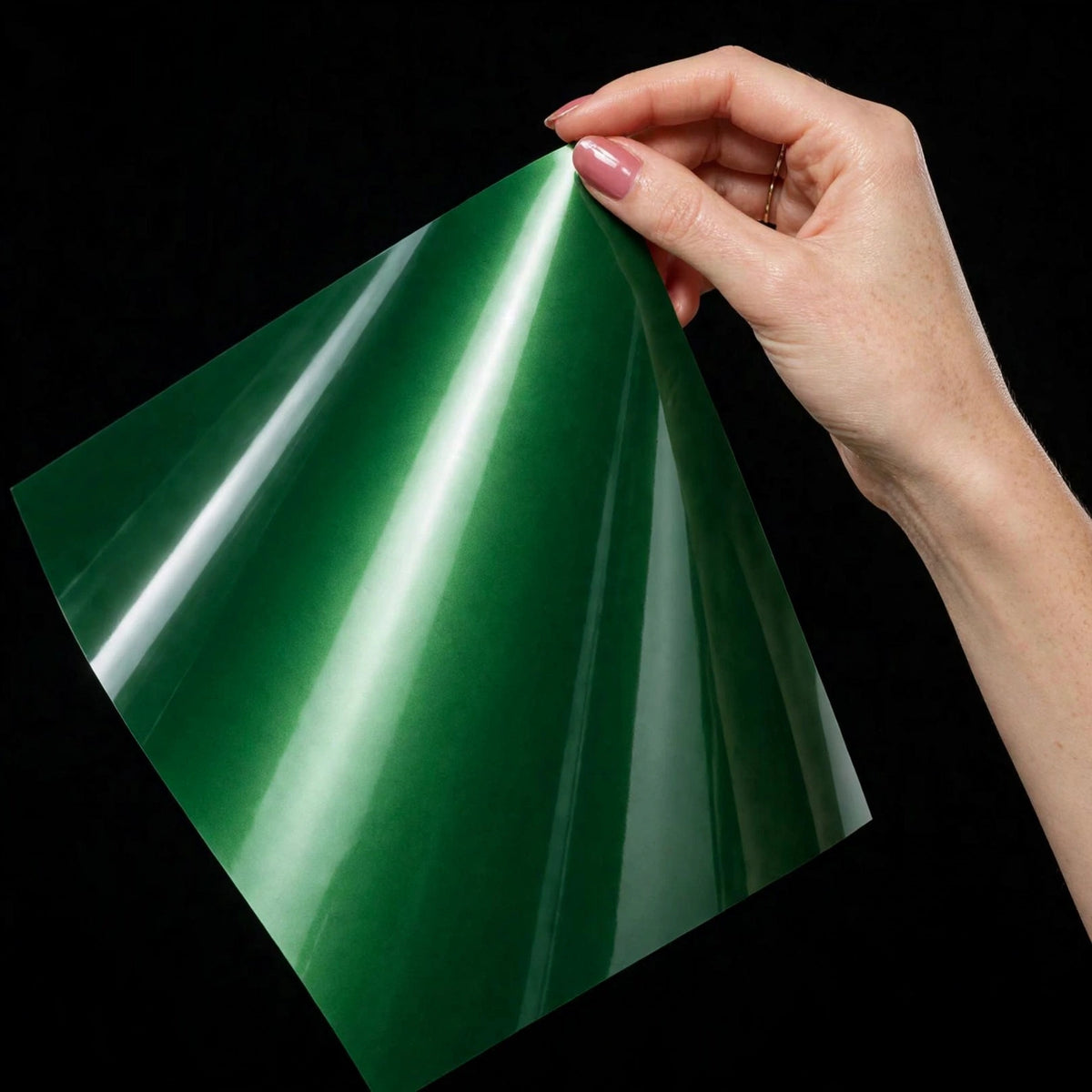 Super Gloss Fedral Green vinyl wrap film sheet held in hand