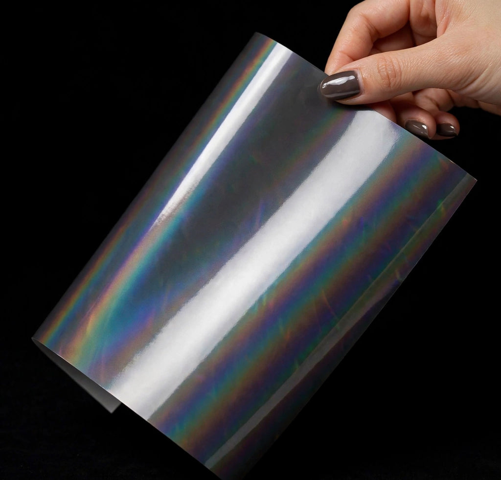 Super Gloss Iridescent Psychedelic Gray vinyl wrap film sheet held in hand